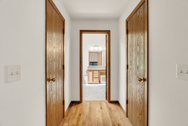 836 Boutell Dr, Grand Blanc, MI 48439 - corridor with light wood finished floors