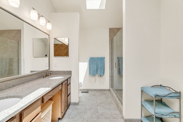 836 Boutell Dr, Grand Blanc, MI 48439 - bathroom with a skylight, a shower stall, double vanity, tile patterned flooring, and toilet