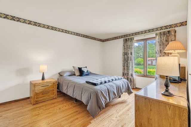 836 Boutell Dr, Grand Blanc, MI 48439 - bedroom with light wood-type flooring and baseboards