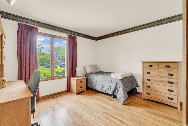 836 Boutell Dr, Grand Blanc, MI 48439 - bedroom featuring light wood finished floors and baseboards