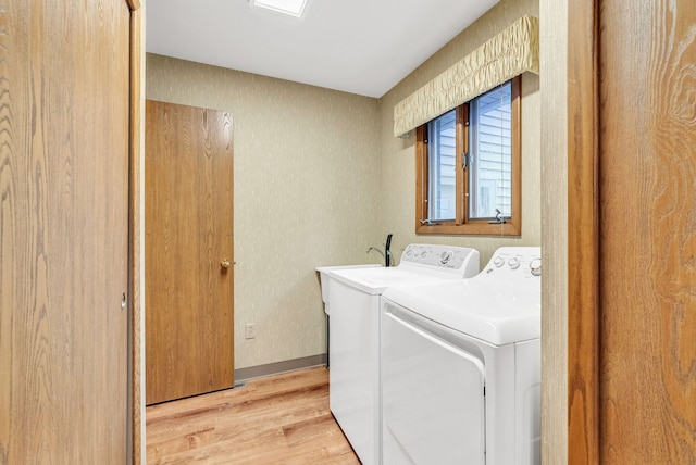 836 Boutell Dr, Grand Blanc, MI 48439 - laundry room featuring light wood finished floors, washing machine and clothes dryer, and baseboards