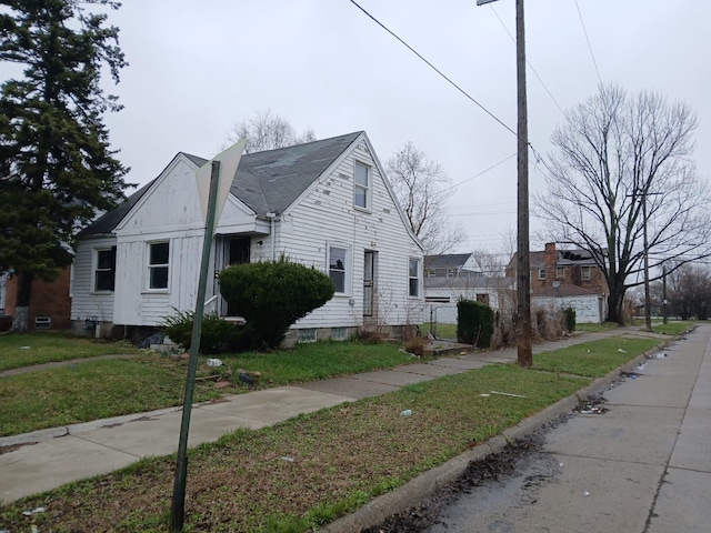 20000 Pelkey St, Detroit, MI 48205 - view of front facade featuring a front yard and entry steps