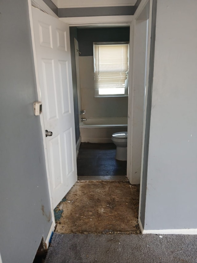20000 Pelkey St, Detroit, MI 48205 - bathroom featuring toilet, baseboards, and bathing tub / shower combination