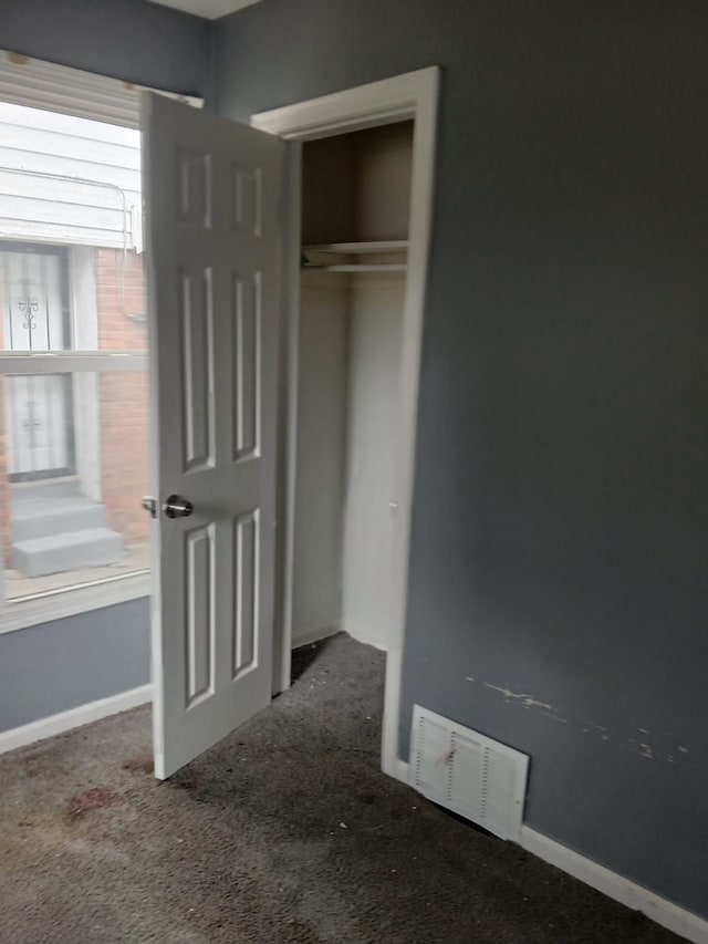 20000 Pelkey St, Detroit, MI 48205 - unfurnished bedroom featuring carpet floors, a closet, and baseboards
