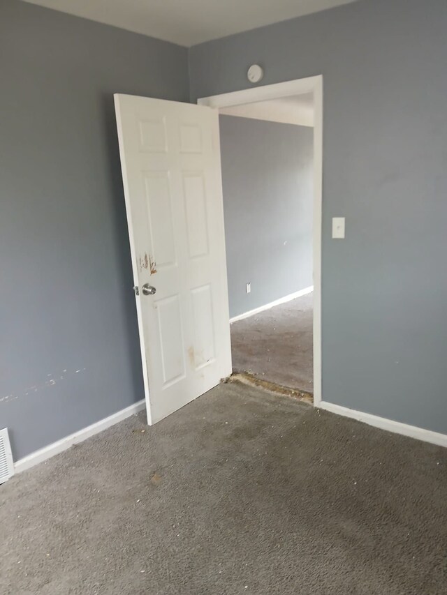 20000 Pelkey St, Detroit, MI 48205 - spare room with a smoke detector, baseboards, and carpet floors