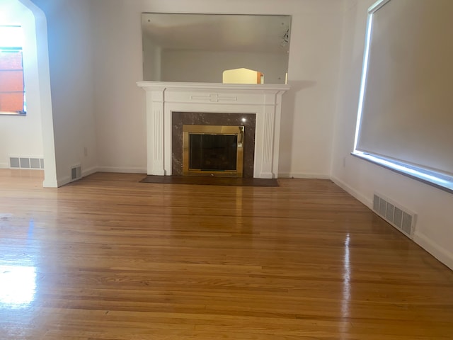19121 Curtis St, Detroit, MI 48219 - unfurnished living room with wood finished floors, a premium fireplace, and baseboards