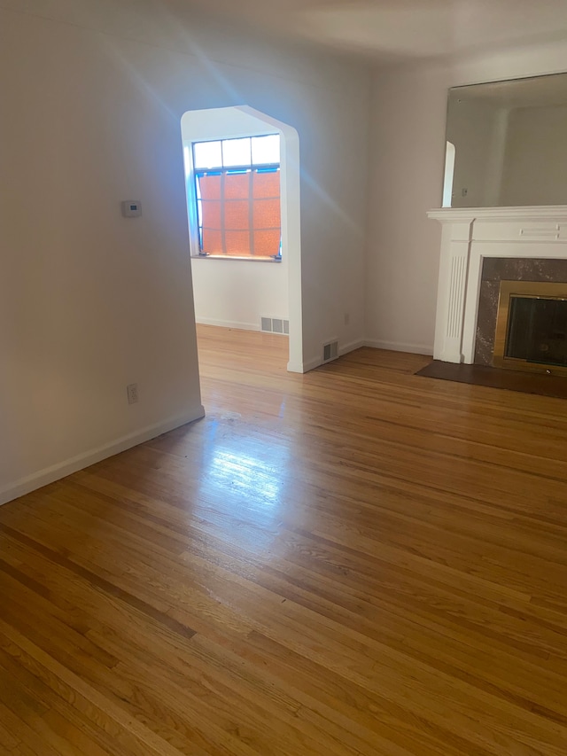 19121 Curtis St, Detroit, MI 48219 - unfurnished living room featuring wood finished floors, baseboards, and a fireplace