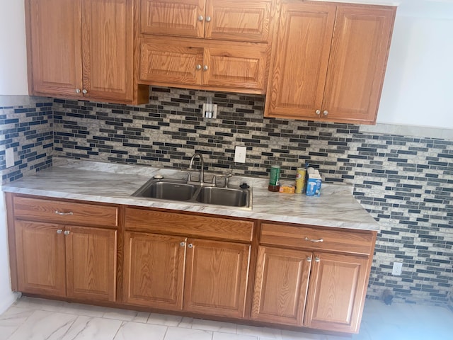 19121 Curtis St, Detroit, MI 48219 - kitchen featuring a sink, light countertops, and brown cabinets