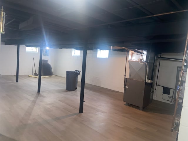 19121 Curtis St, Detroit, MI 48219 - basement featuring heating unit and wood finished floors