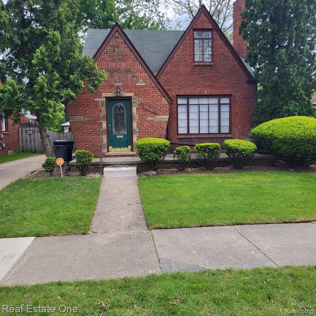 19121 Curtis St, Detroit, MI 48219 - tudor house with brick siding and a chimney