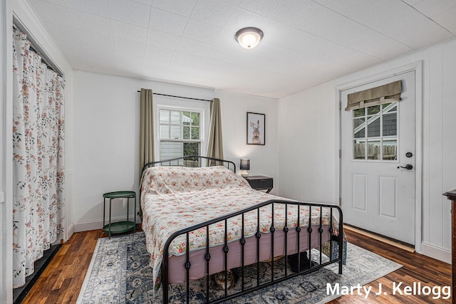 bedroom with wood finished floors