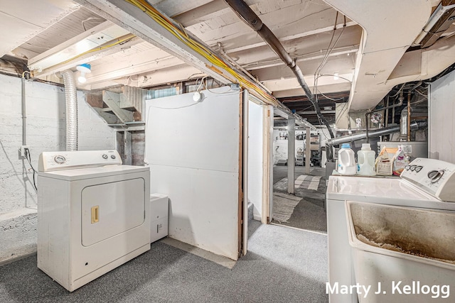 clothes washing area with separate washer and dryer