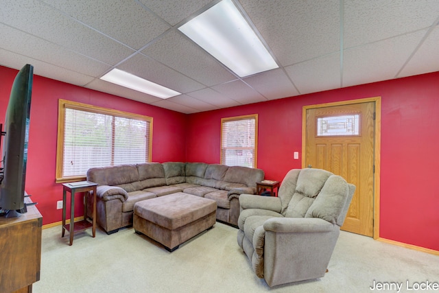 608 Porter Rd, Norton Shores, MI 49441 - carpeted living area with a paneled ceiling and baseboards