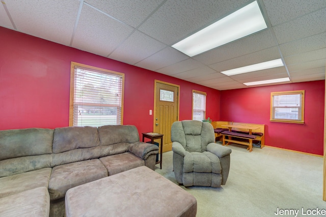 608 Porter Rd, Norton Shores, MI 49441 - carpeted living room featuring a paneled ceiling and healthy amount of natural light