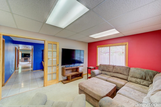 608 Porter Rd, Norton Shores, MI 49441 - living area with a paneled ceiling, baseboards, and carpet