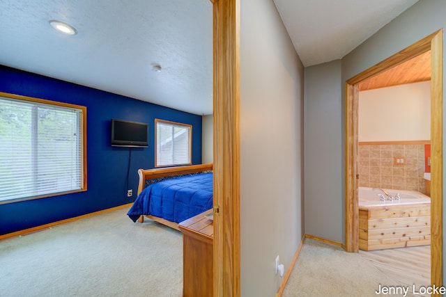 608 Porter Rd, Norton Shores, MI 49441 - bedroom featuring carpet flooring, baseboards, and ensuite bath