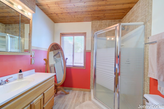 608 Porter Rd, Norton Shores, MI 49441 - bathroom with wood finished floors, wooden ceiling, a stall shower, vanity, and baseboards
