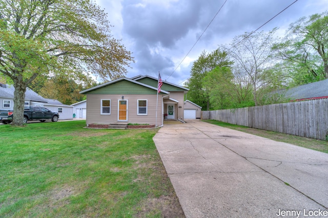608 Porter Rd, Norton Shores, MI 49441 - bungalow-style home with a detached garage and an outdoor structure