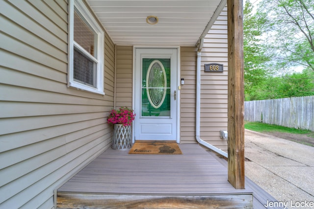 608 Porter Rd, Norton Shores, MI 49441 - doorway to property featuring fence
