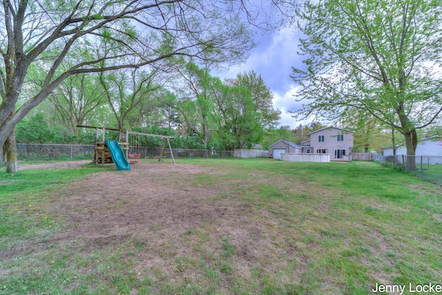 608 Porter Rd, Norton Shores, MI 49441 - view of yard with a playground