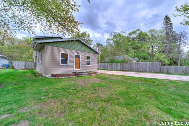 608 Porter Rd, Norton Shores, MI 49441 - bungalow-style home featuring concrete driveway