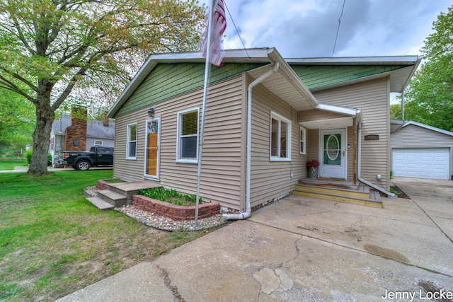 608 Porter Rd, Norton Shores, MI 49441 - view of front of house with concrete driveway and a front lawn