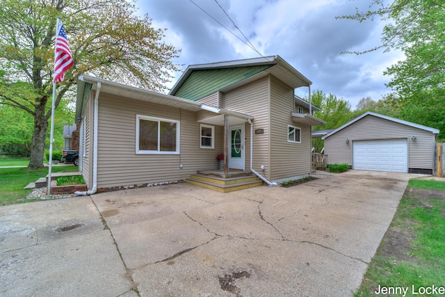 608 Porter Rd, Norton Shores, MI 49441 - view of front of house with an outbuilding, a garage, and driveway