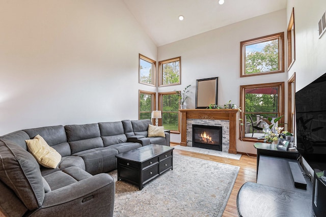 4024 Austin Ct, Lapeer, MI 48446 - living room featuring high vaulted ceiling, a high end fireplace, light wood finished floors, and recessed lighting