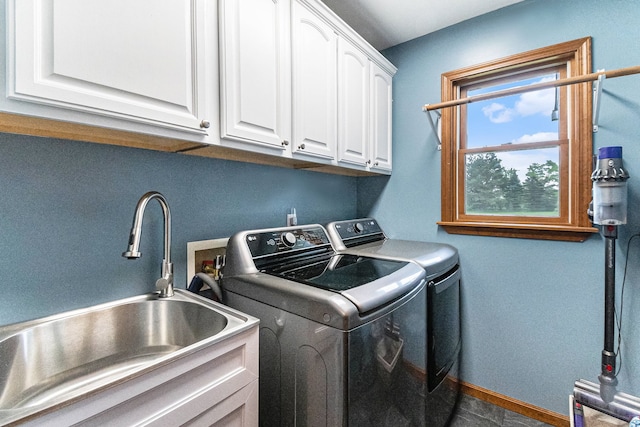 4024 Austin Ct, Lapeer, MI 48446 - laundry room featuring washer and clothes dryer, cabinet space, and baseboards