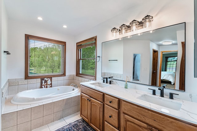 4024 Austin Ct, Lapeer, MI 48446 - bathroom with healthy amount of natural light, connected bathroom, a garden tub, double vanity, and recessed lighting