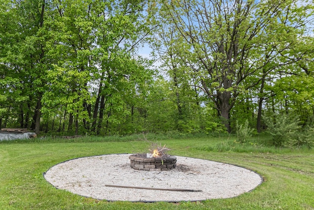 4024 Austin Ct, Lapeer, MI 48446 - view of grassy yard featuring an outdoor fire pit