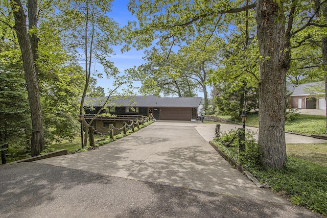 10706 Portage Rd, Portage, MI 49002 - view of front facade featuring concrete driveway and an attached garage