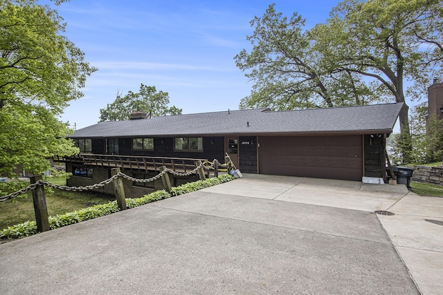 10706 Portage Rd, Portage, MI 49002 - single story home featuring concrete driveway, a chimney, and a garage