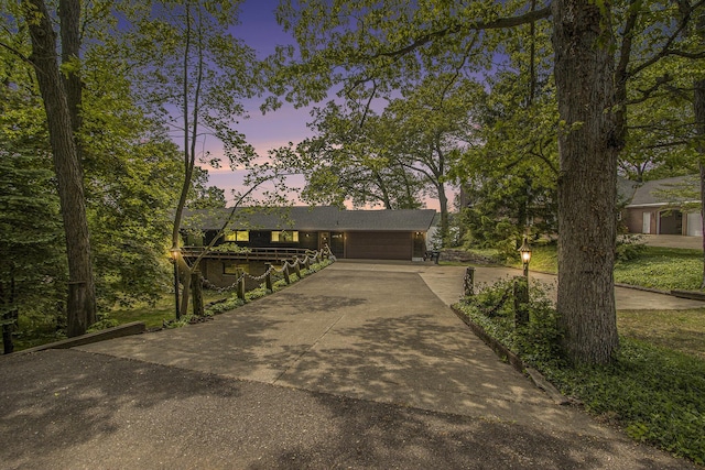 10706 Portage Rd, Portage, MI 49002 - view of front facade featuring driveway and a garage