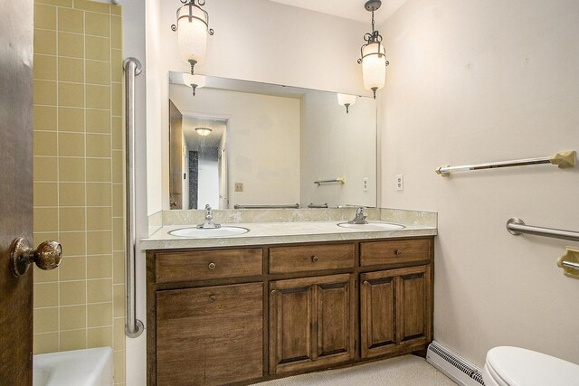 10706 Portage Rd, Portage, MI 49002 - bathroom with a baseboard radiator, toilet, and double vanity