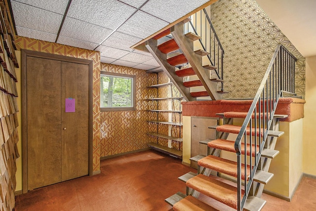 10706 Portage Rd, Portage, MI 49002 - staircase with carpet floors, wood walls, and baseboards