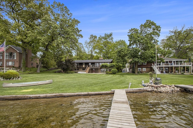10706 Portage Rd, Portage, MI 49002 - dock area with stairway, a yard, and a deck with water view