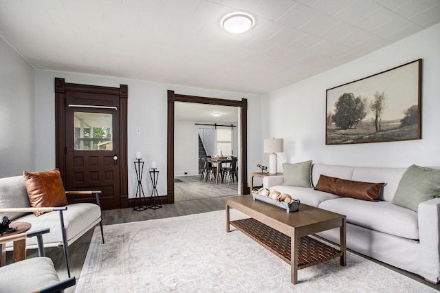 living room with wood finished floors and baseboards