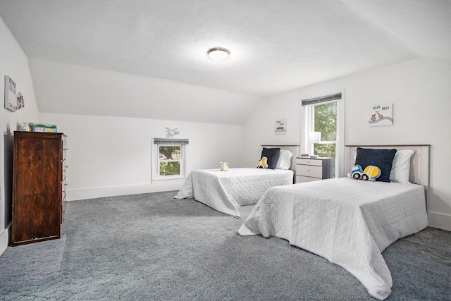 carpeted bedroom with vaulted ceiling and baseboards
