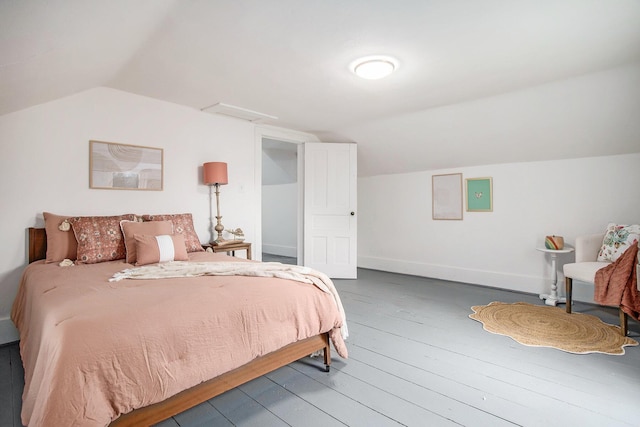 bedroom with lofted ceiling, electric panel, and wood-type flooring