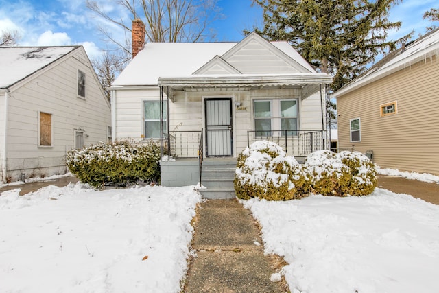 15819 Eastburn St, Detroit, MI 48205 - view of front of property with covered porch and a chimney
