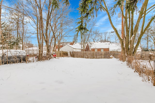 15819 Eastburn St, Detroit, MI 48205 - snowy yard featuring fence