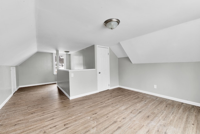 15819 Eastburn St, Detroit, MI 48205 - additional living space with wood finished floors, vaulted ceiling, and baseboards