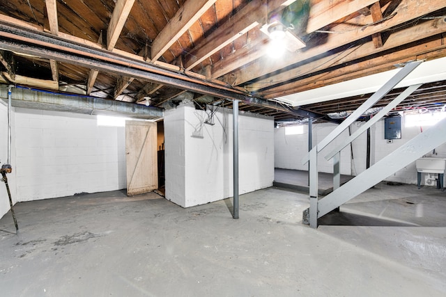 15819 Eastburn St, Detroit, MI 48205 - basement with electric panel, stairs, and concrete block wall