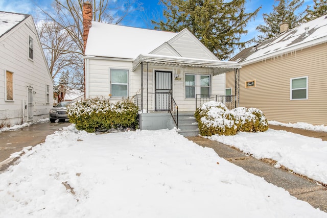 15819 Eastburn St, Detroit, MI 48205 - view of front of home with a chimney and covered porch