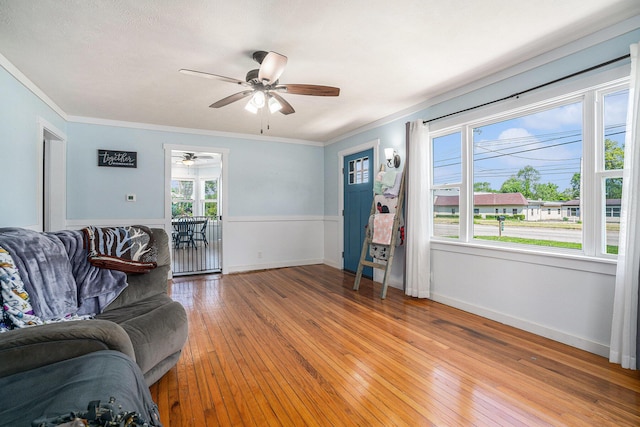 509 W W Burr Oak St, Centreville, MI 49032 - living room with ceiling fan, ornamental molding, light wood-style flooring, and baseboards