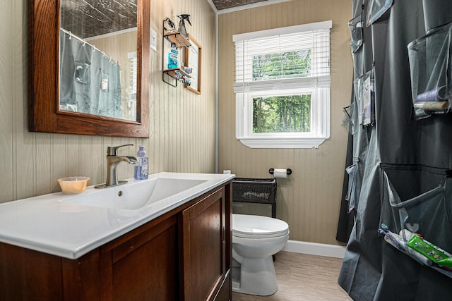 509 W W Burr Oak St, Centreville, MI 49032 - bathroom featuring toilet, baseboards, vanity, wallpapered walls, and crown molding