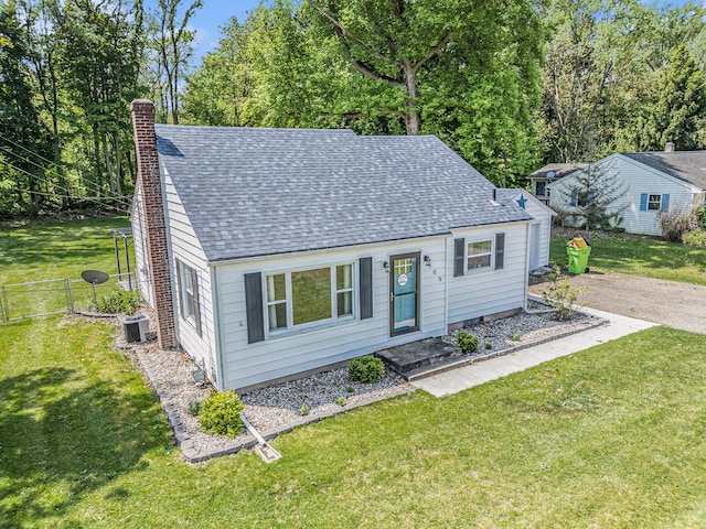 509 W W Burr Oak St, Centreville, MI 49032 - view of front of house featuring a chimney, central air condition unit, and a shingled roof