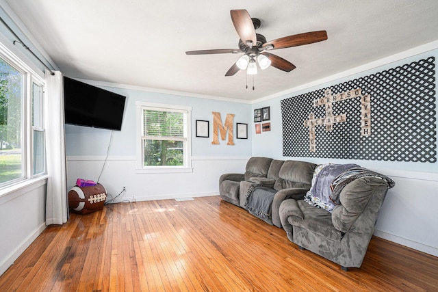 509 W W Burr Oak St, Centreville, MI 49032 - living room with wood-type flooring, a ceiling fan, ornamental molding, and baseboards