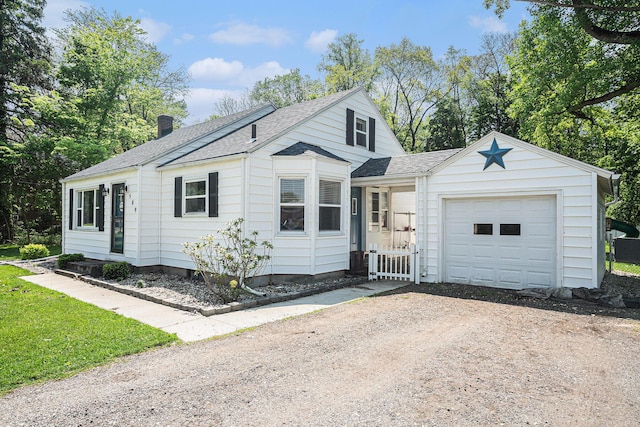 509 W W Burr Oak St, Centreville, MI 49032 - view of front of property with dirt driveway, a shingled roof, an attached garage, and a chimney